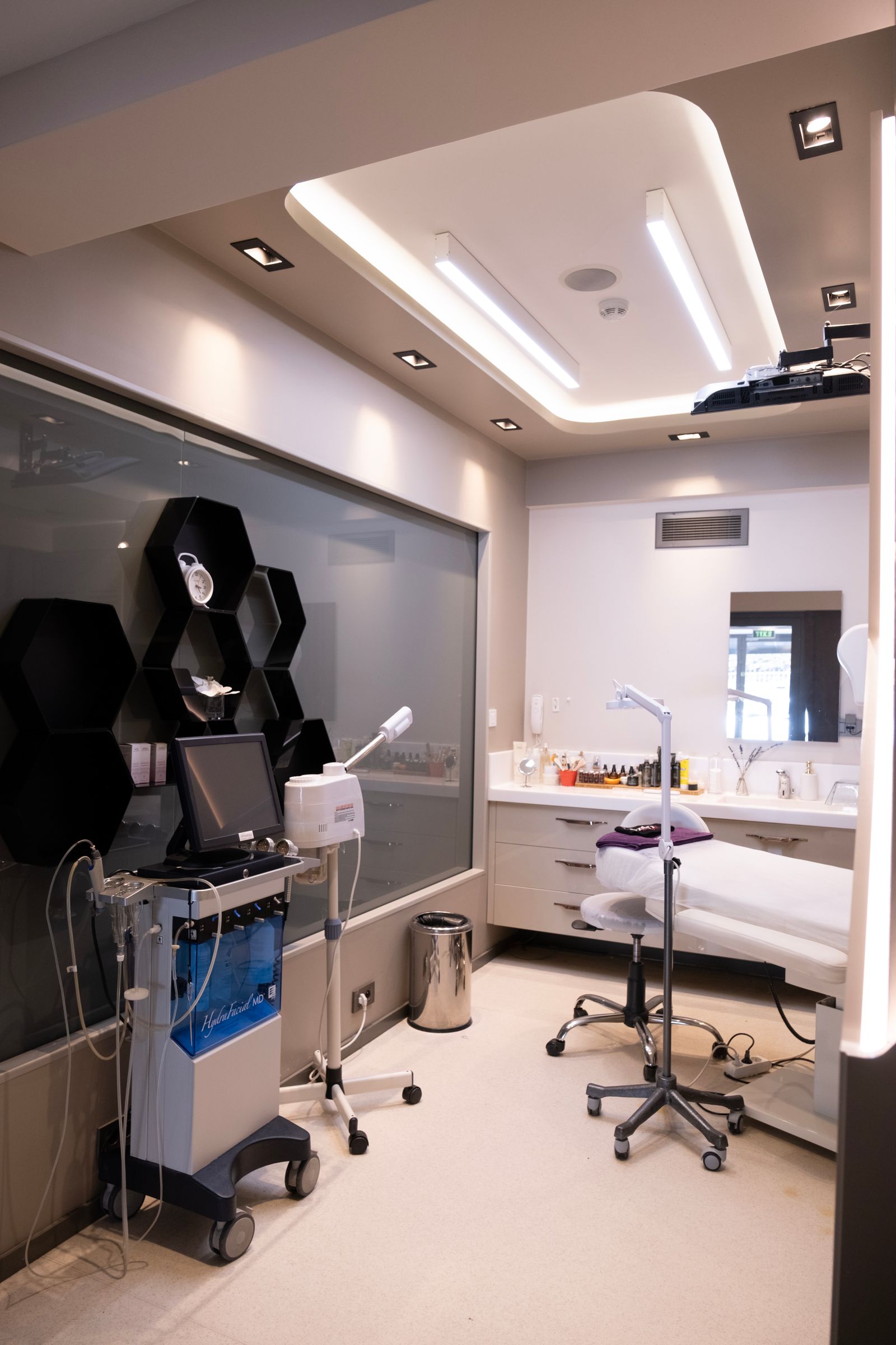A modern clinical treatment room with medical-grade equipment and calibrated lighting